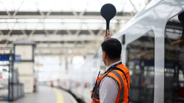 A train conductor at Waterloo station