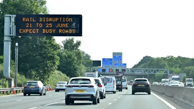 A message board warns of busy roads on the M3 motorway