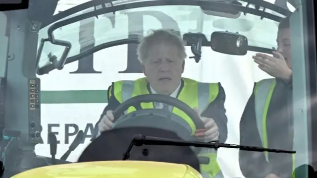 Boris Johnson on a tractor