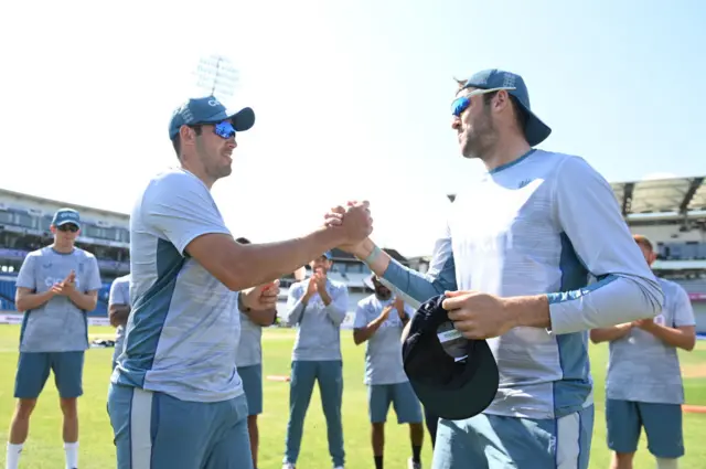 Jamie Overton being presented with his first cap by brother Craig