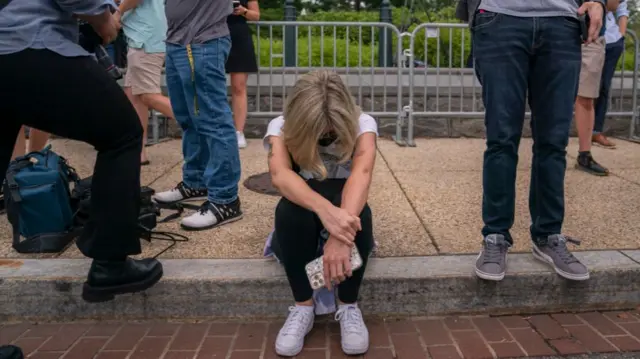 Image shows activist outside Supreme Court