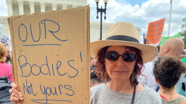 Image of pro-choice protestor outside the Supreme Court