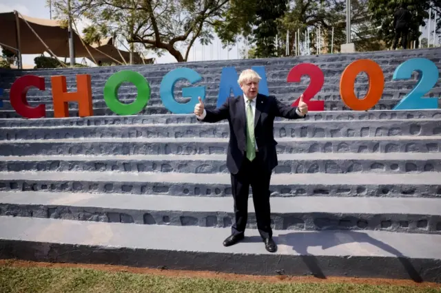 .British Prime Minister Boris Johnson poses as he attends the Commonwealth Business Forum Exhibition in Kigali, Rwanda, on 23 June 2022