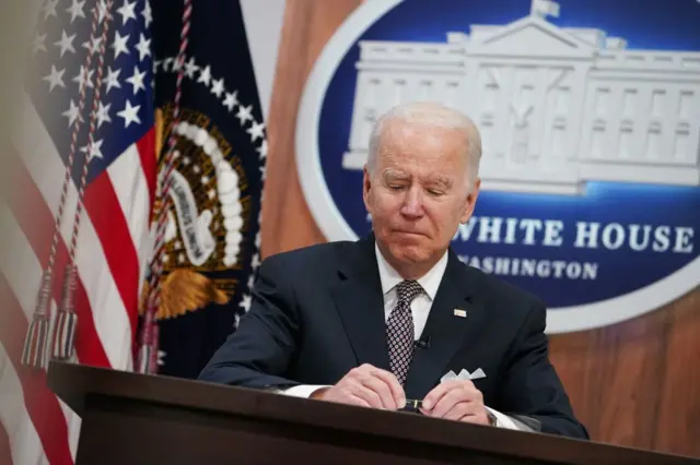 President Joe Biden at a podium.