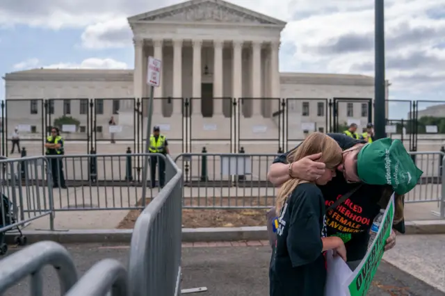 Image shows protester outside Supreme Court