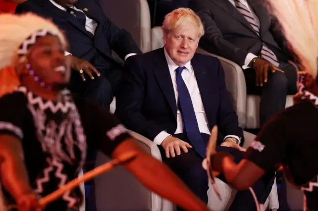 British Prime Minister Boris Johnson looks on during the opening ceremony of the Commonwealth Heads of Government Meeting