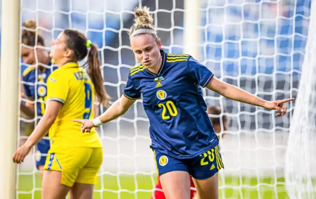 Martha Thomas wheels away after finishing at the back post