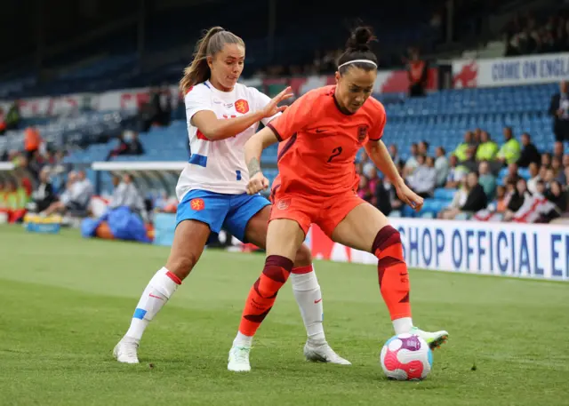 Netherlands' Lieke Martens in action with England's Lucy Bronze