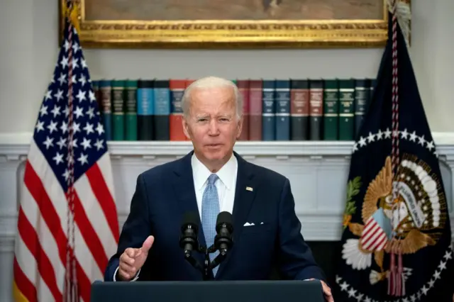 Image shows President Joe Biden speaking at the White House