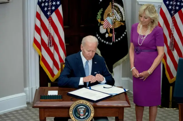 President Joe Biden signs the Bipartisan Safer Communities Act into law