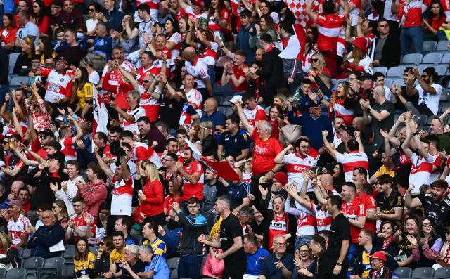 Derry fans celebrate a goal