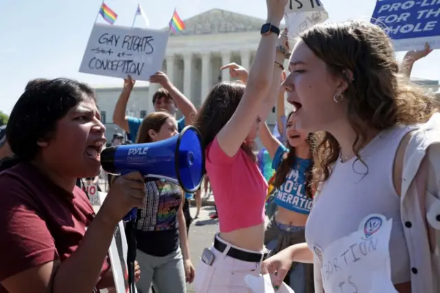 Two demonstrators stand off