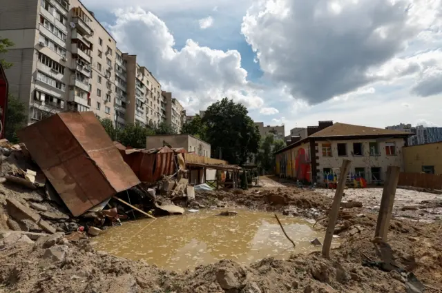 A crater is seen at a compound of a kindergarten after a Russian missile strike in Kyiv