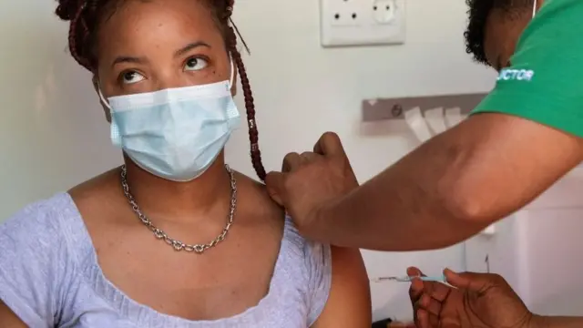 A woman gets the coronavirus jab in South Africa.