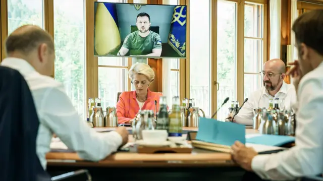 G7 leaders listen to Ukrainian President Volodymyr Zelensky on a video link at the G7 summit