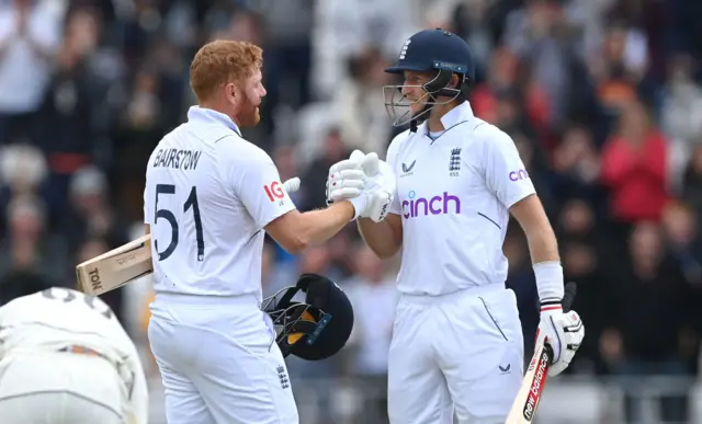 Jonny Bairstow shakes hands with Joe Root