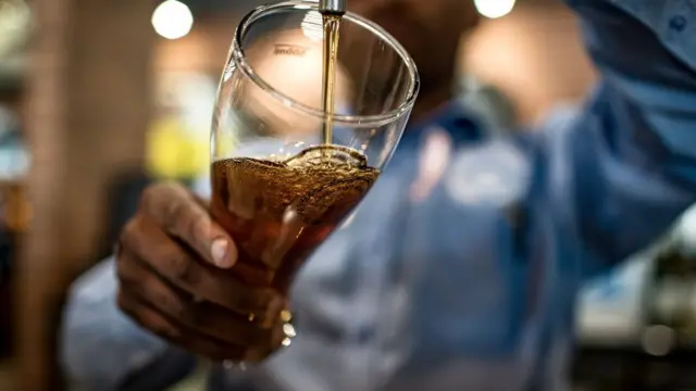 A barman pulls a pint in Johannesburg.