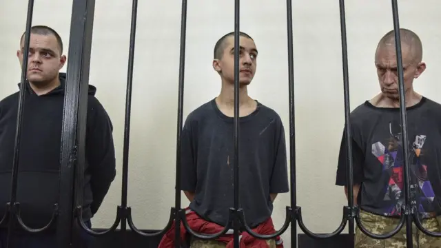 Three men behind bars