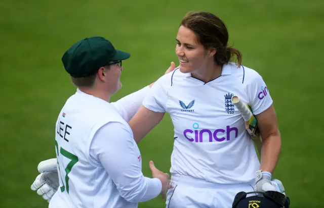 England's Nat Sciver is congratulated by South Africa's Lizelle Lee after finishing unbeaten on 169