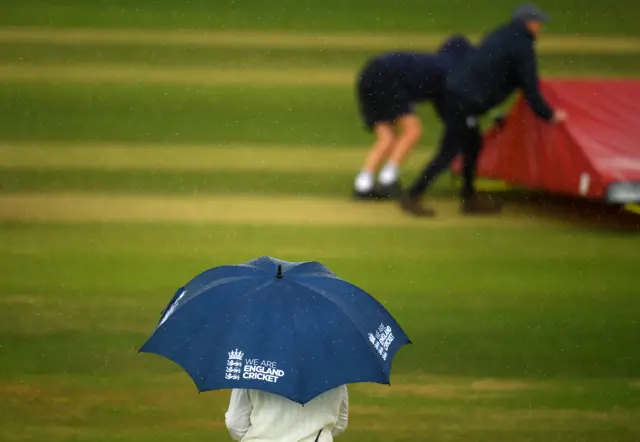 Umbrella up as rain stops play in England v South Africa Test at Taunton