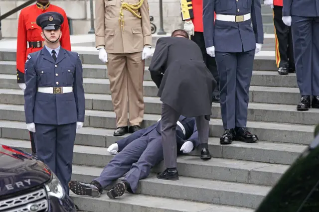 Member of armed forces collapsing