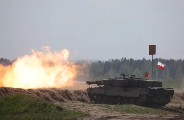 A Polish Leopard 2 tank firing during a military exercise in Poland