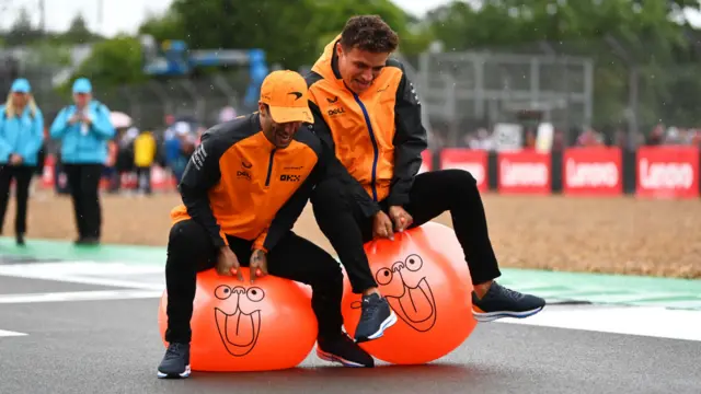 Daniel Ricciardo and Lando Norris on space hoppers