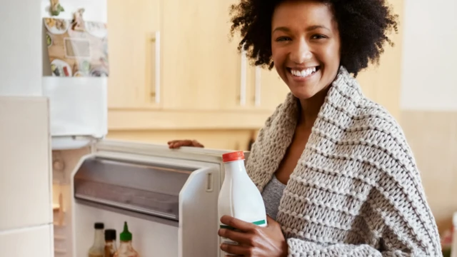 A woman by a fridge in South Africa