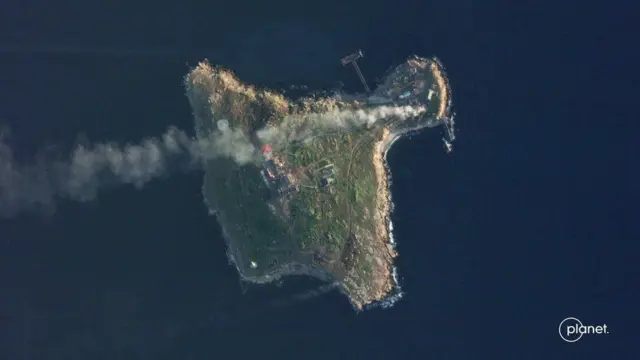 Satellite image shows smoke rising above Snake Island