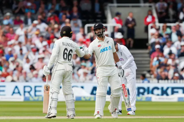 New Zealand's Tom Blundell and Daryl Mitchell shake hands at Lord's