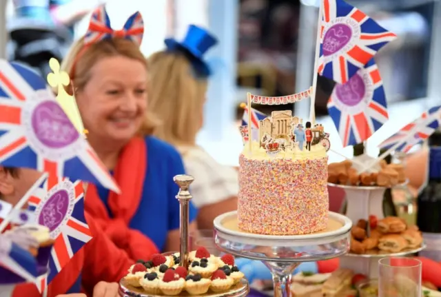 People attend a Jubilee-themed community lunch in Eton, near Windsor, UK, on 4 June 2022