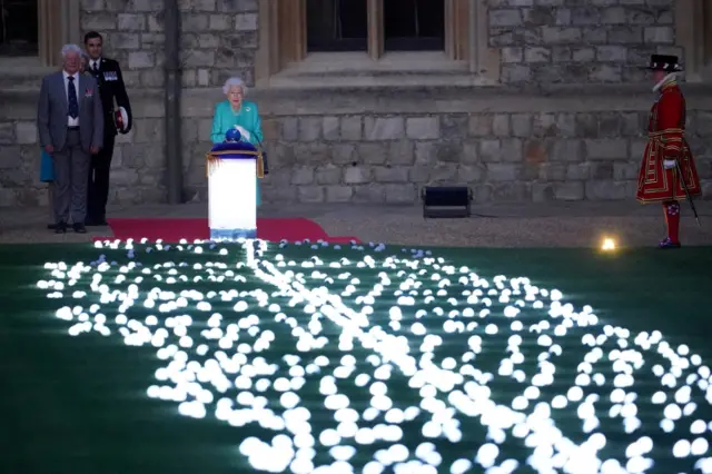 Britain's Queen Elizabeth leads the lighting of the principal jubilee beacon, as part of Platinum Jubilee celebrations, at Windsor Castle, UK, on 2 June 2022