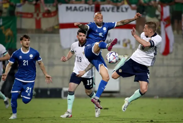 Steven Davis challenges for the ball