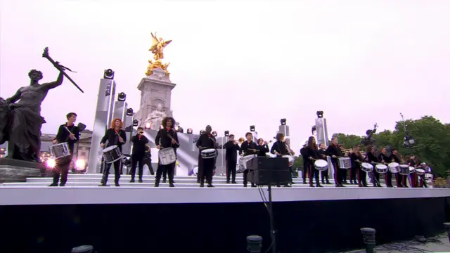 Performers in front of Buckingham Palace