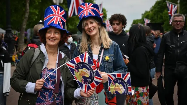 Women in union flag clothing on the Mall