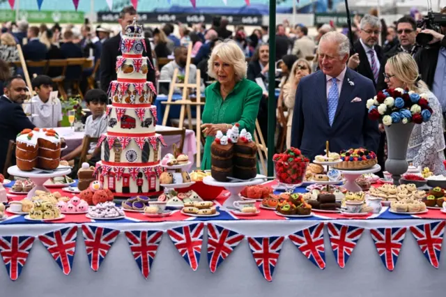 Prince Charles and his wife Camilla, Duchess of Cornwall, look at decorations at The Oval cricket ground as they attend a Big Jubilee Lunch in London, UK, on 5 June 2022