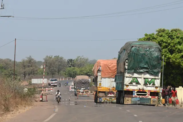 A long line of truck carrying goods whose transport is not affected by the recent embargo imposed by Ecowas sanctions