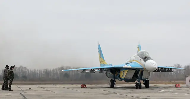 A Ukrainian fighter jet on a runway