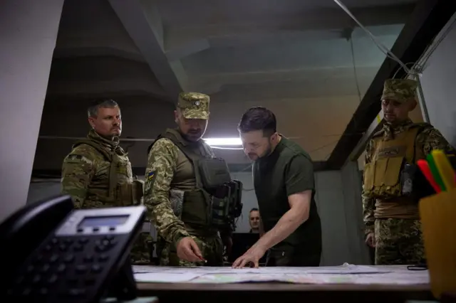 Ukraine's President Zelensky talks to servicemen
