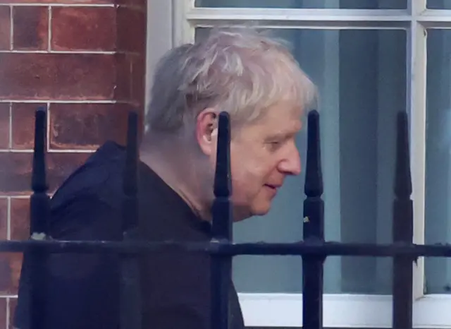 Boris Johnson leaves the back entrance of Downing Street the morning after winning a no-confidence vote