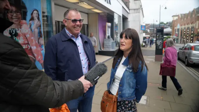 Husband and wife Adam and Lynsey Rimmington speak to the BBC in Guildford