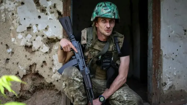 A Ukrainian service member is a pictured at a position on the front line, amid Russia's attack on Ukraine, near Bakhmut, Donbas region Ukraine