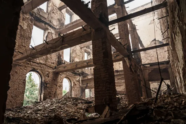 Interior of a ruined building filled with rubble