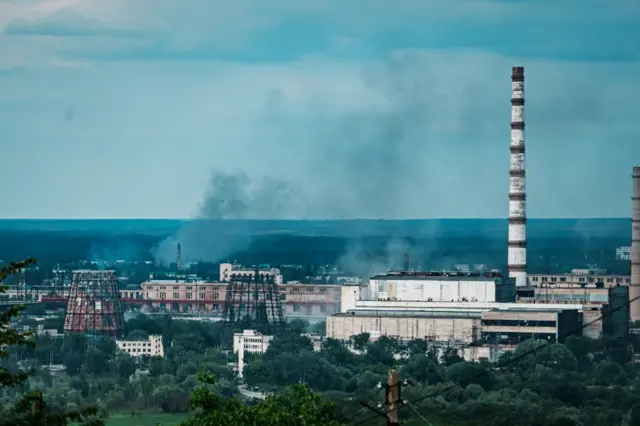 A plume of smoke rises above Severodonetsk