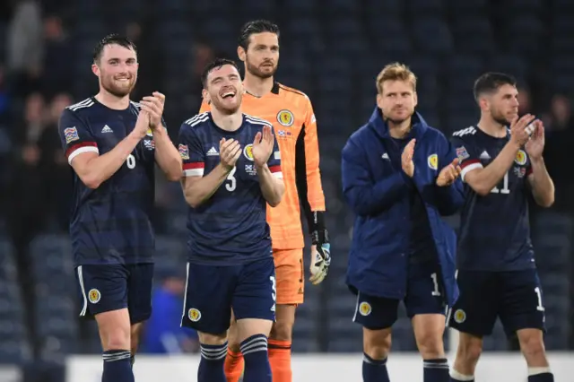 John Souttar and Andy Robertson applaud the support post-match