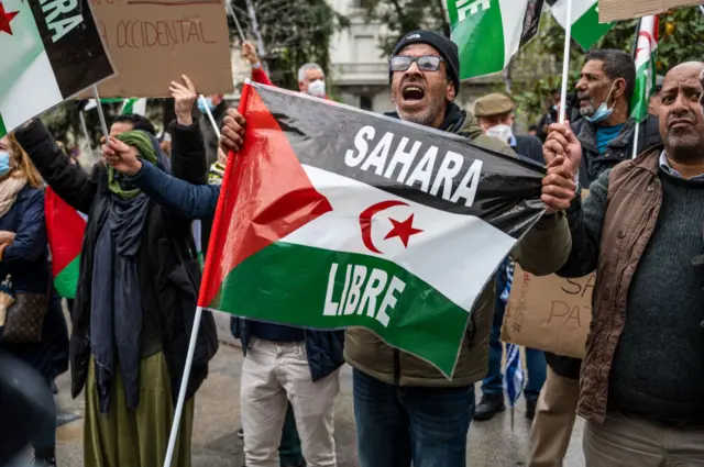 Members of the Saharawi community and supporters are seen with flags and placards during a demonstration in front of the Congress of Deputies where they have gathered to protest against the Spanish government's support for Morocco's autonomy plan for Western Sahara, which grants a limited autonomy to Western Sahara - March 2022