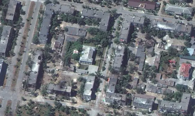 Satellite image shows blackened buildings