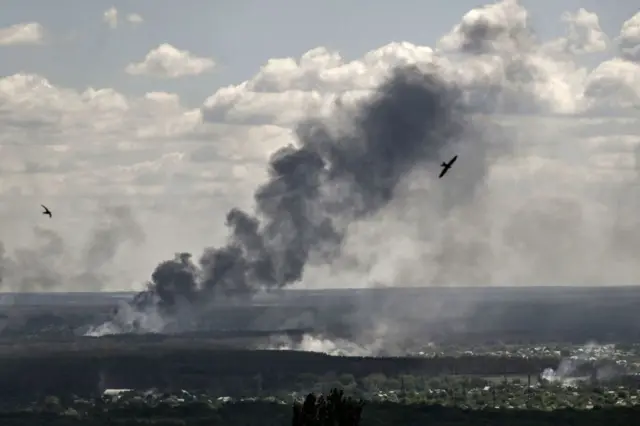 Smoke and dirt rise from shelling in the city of Severodonetsk