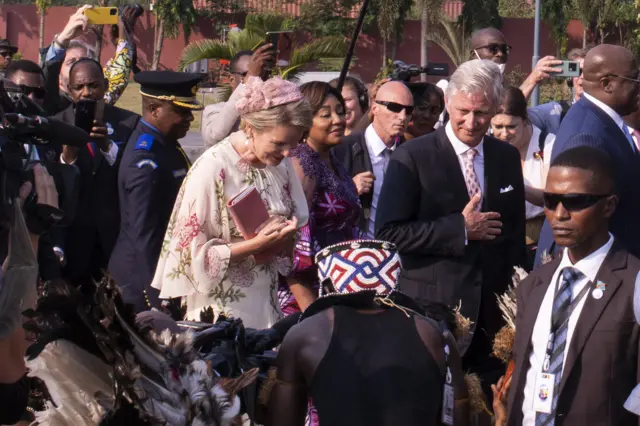 Belgium's King Philippe (R) and Belgium's Queen Mathilde are greeted upon their arrival at the N'djili International Airport in Kinshasa on June 7, 2022.