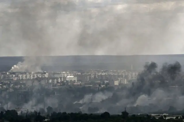 Smoke rises above rooftops in Severodonetsk